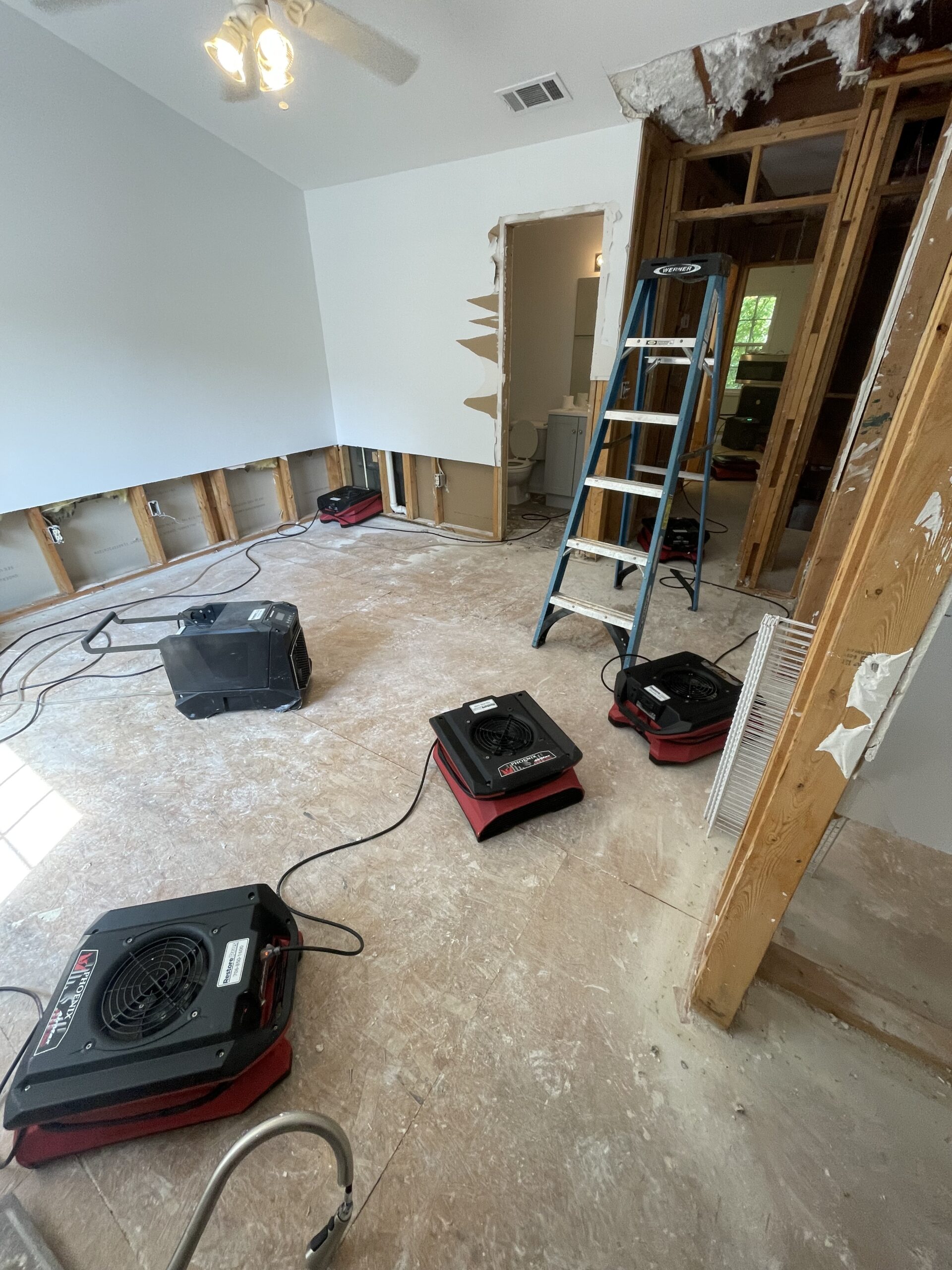 Restore Pros a local restoration company offers a comprehensive mold remediation service Restore Pros drying and inspection equipment set up during a mold assessment in Athens, GA